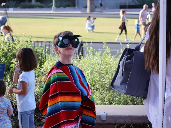 Kid with Eclipse goggles