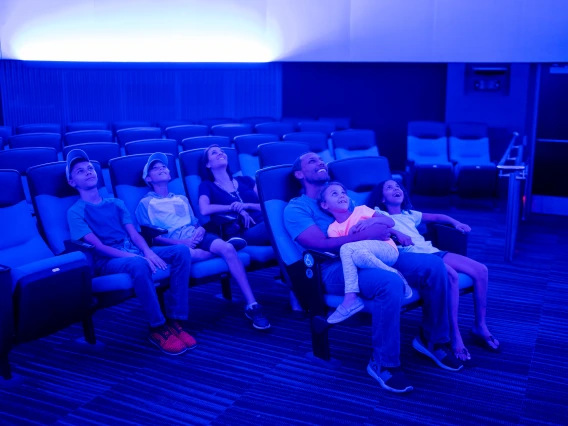 family enjoying planetarium show