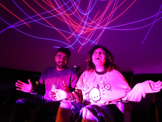 Young Adults at Flandrau laser Show