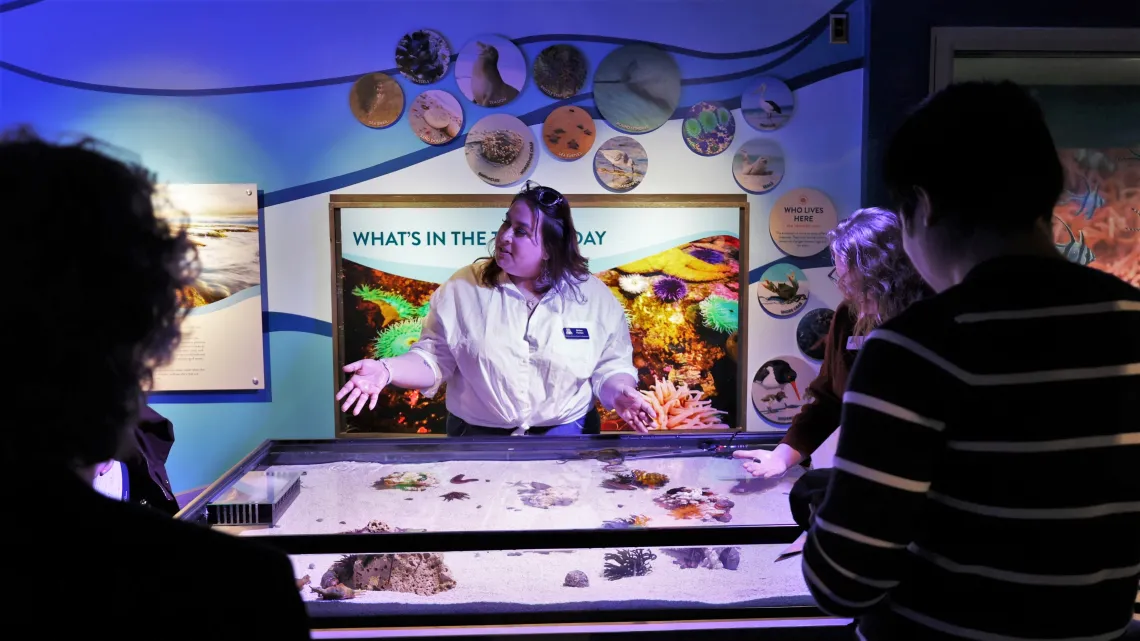 Instructor at touch tank flandrau