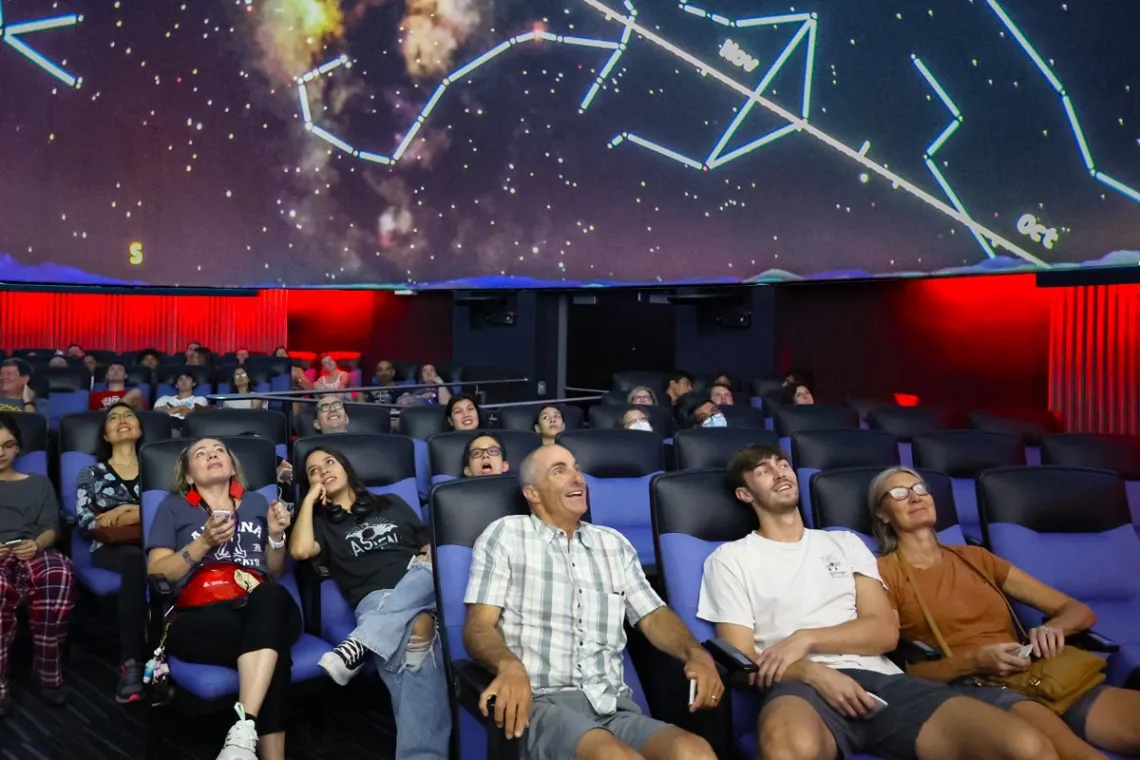 Families in Flandrau Planetarium enjoying the show