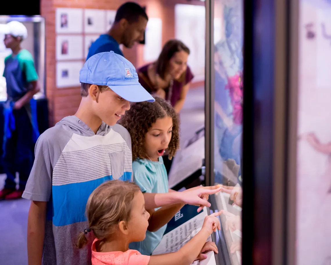 Family visiting exhibits at Flandrau science center